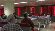 تأثير أزمة أسواق الأسهم بالصين على المواطنين