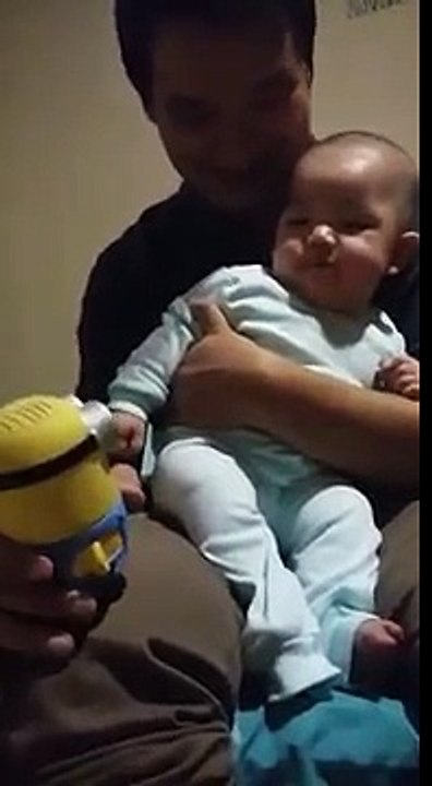 Funny baby laughing at Minion