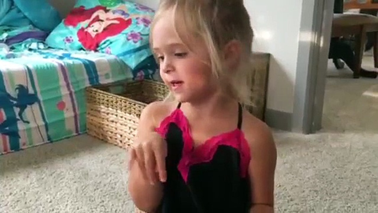 Mia is opening a surprise egg full of shopkins and little pet shop accessories.