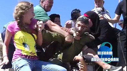 Israeli soldier being beaten by Palestinian women after he tried to arrest a child