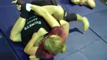 Female kicks ass of male in Jiu jitsu with very special foot choke