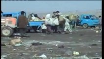 Iraqi Children eke out a living in Baghdad rubbish dump - Iraq War