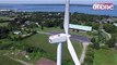 Drone pilot spots man sunbathing on top of wind turbine