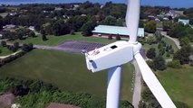 Drone pilot spots man sunbathing on top of wind turbine 200ft above ground