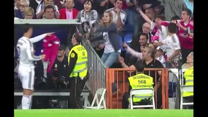 Cristiano Ronaldo gives his shirt to a child