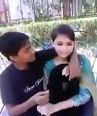 15 years Old Boy And Girl Kissing in Park