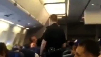Funny Video Wonman gets arrested for singing Whitney Houston Song on plane