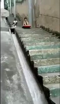 Parents Watch Little Kid Wreck While Stair Surfing