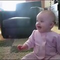 Baby girl laughing hysterically at Dog eating popcorn