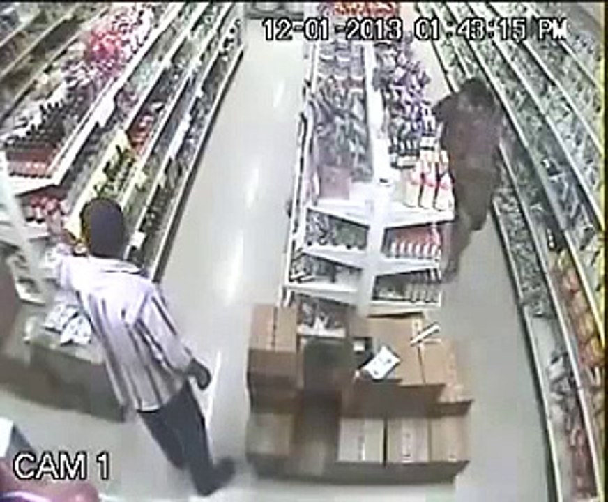 CCTV Footage of Female Thief in Store
