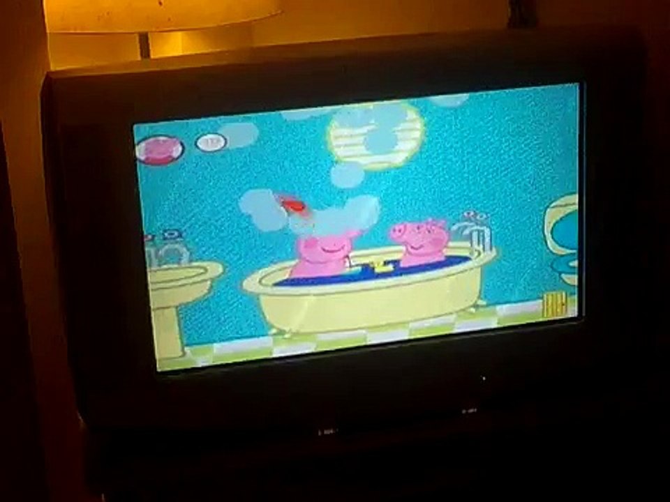 Max plays his new Peppa Pig game on the Wii
