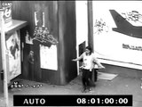 CCTV -- Girl rubs her own back on lamppost