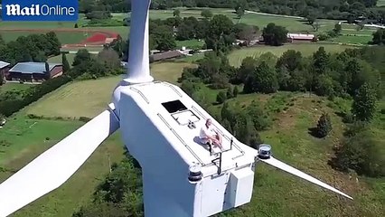 Drone Catches Man Sunbathing on Top of a 200ft Wind Turbine