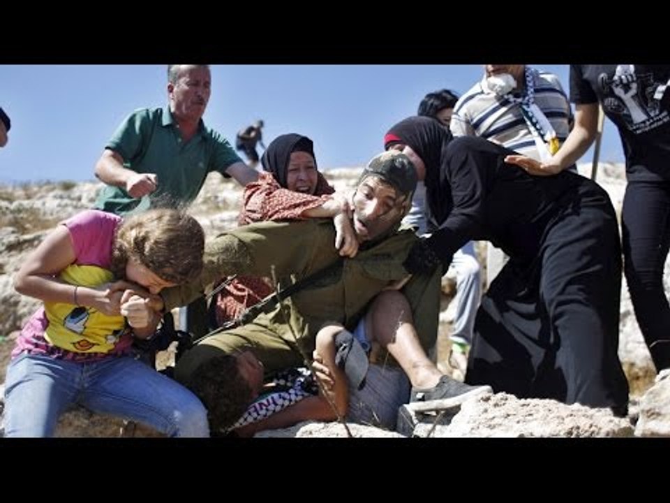 Palestinian women, teenage girl bite, fight off IDF soldier trying to arrest 12-yo boy