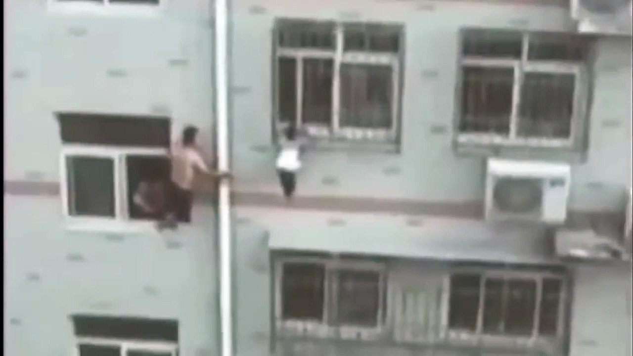 Girl Hanging From Window Saved By Man With Broom