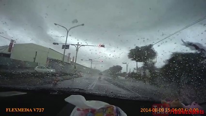 Car cuts off another and gets sucked up by a tornado.