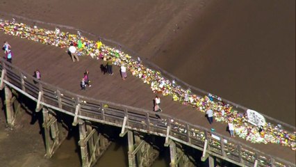 Aerials of Shoreham's bridge of flowers