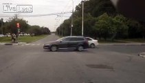 Biker going 170 kph crashes and slides into curb.