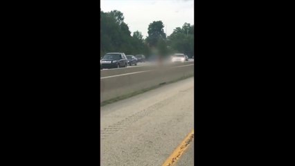 Naked man running down Cincinnati Highway