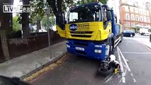 Biker almost gets run over by truck