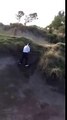 Man attempts difficult bunker shot, tumbles backwards in said bunker