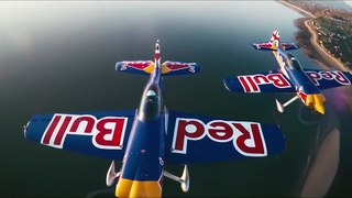 Stunt pilots fly through building together