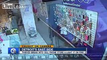 Suspects caught on camera robbing Metro PCS store and set it on fire Detroit