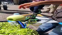 Street vendor sells corkscrew sliced apples