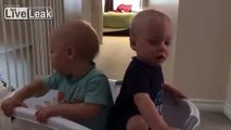 Adorable twins imitating their mom