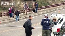 Video: Tourists try to act casual as they flee mama bear