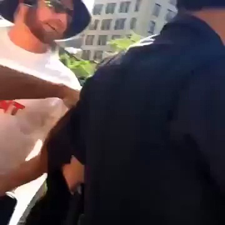 Cop Punches Woman In The Stomach, Crowd Outraged