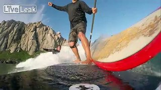Surfer attempts to snake a paddle boarder and pays a visit to the bottom