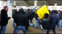 Stupid German Hooligan Throwing Garbage Can At Riot Police Hits Own Mate Intstead