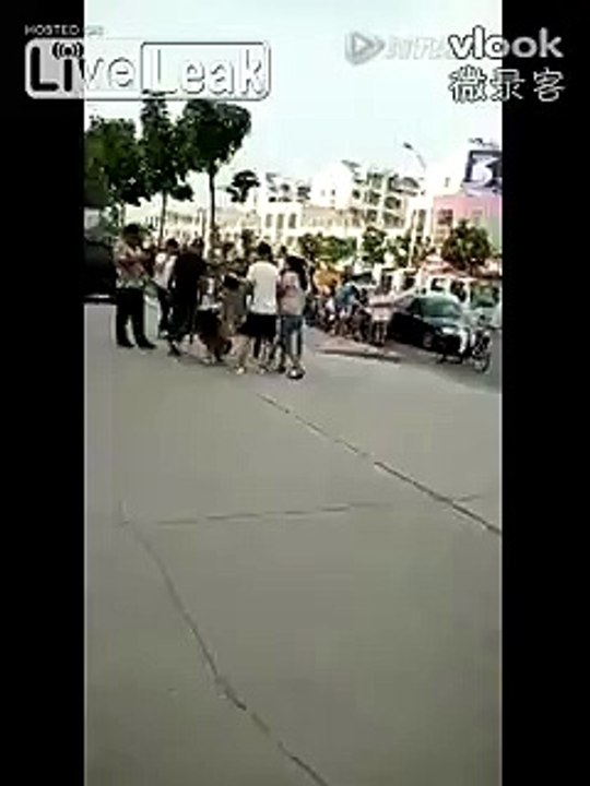 Woman stripped topless in public