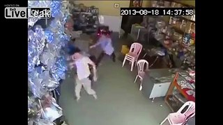 Epic battle between shopkeepers and armed robbers