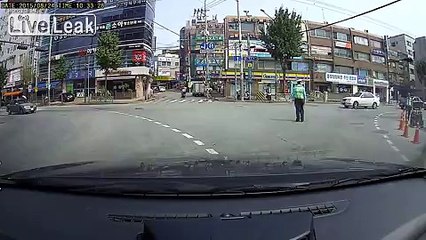 Traffic Cop Knocked out by passing vehicle