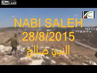 An Israeli soldier attacks a child whose hand is broken