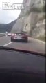Idiots in their sports car drive on wrong side of road and nearly have an accident