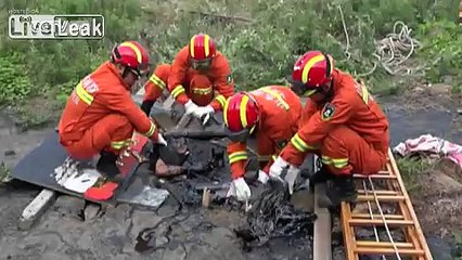 Trapped Old Man Rescued from Asphalt Pit By Firemen