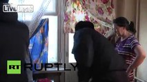 Russia: Man busted by cops... in his mother's FRIDGE!?