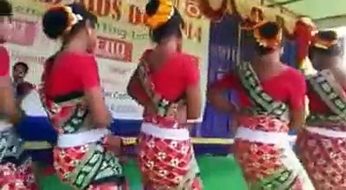 Tribal children playing music for tribal children to dance Dhemsa at Koraput