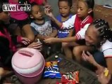 group of Kids Drinking Vodka in the Philippines w/ parents around