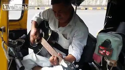 INDIA - Auto rickshaw driver plays guitar :)