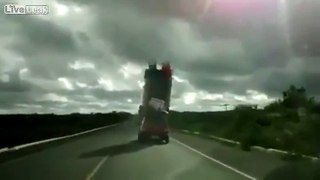 Brazil - Car carrying 2 meters pile above it, on the road.