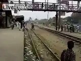 Guy surfing on train hit by overpass and tumbles infront of shocked bystanders