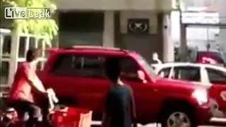 Trouble maker tries to hit a cop but get rushed by angry bystanders