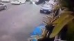 Man Opens Car Door and Knocks Scooter Rider Under Truck, Wheel Rolls Over His Head