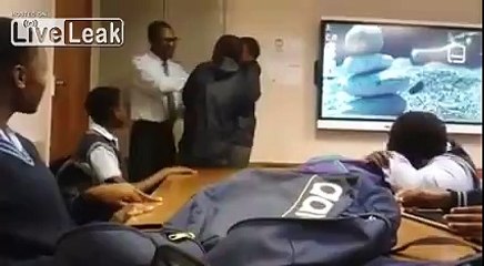 Teacher slaps kids for not doing their homework.