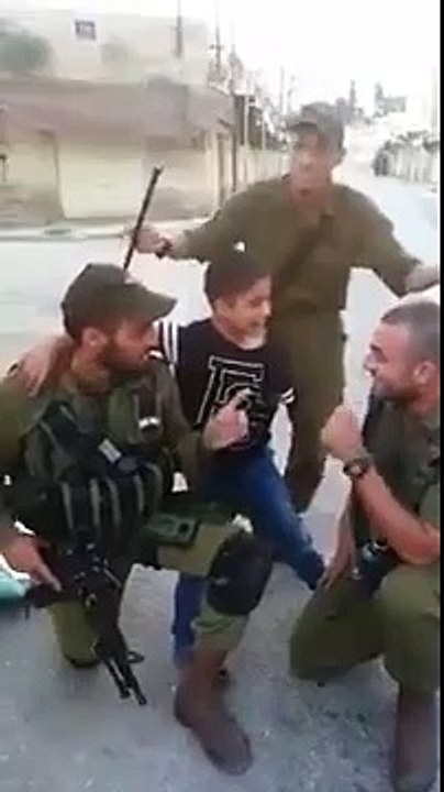 Israeli IDF soldiers teach Palestinian Arab kid a song