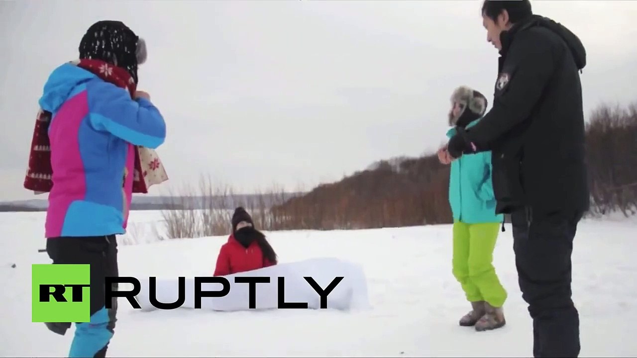 Bikini girls pole dance in minus 50 degree winter weather in China